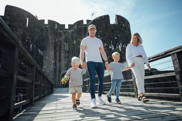 Family leaving Caerphilly Castle