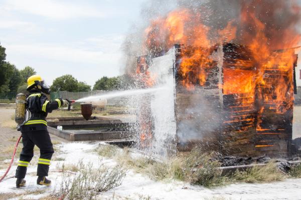 firefighter extinguishing flames