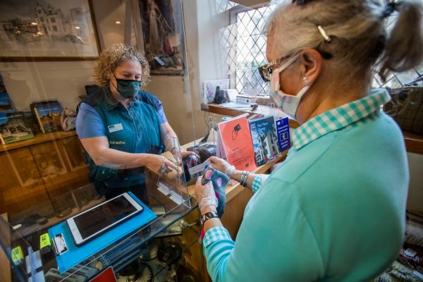 person purchasing something in a post office
