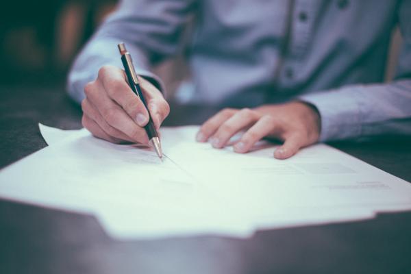 Person filling out paperwork
