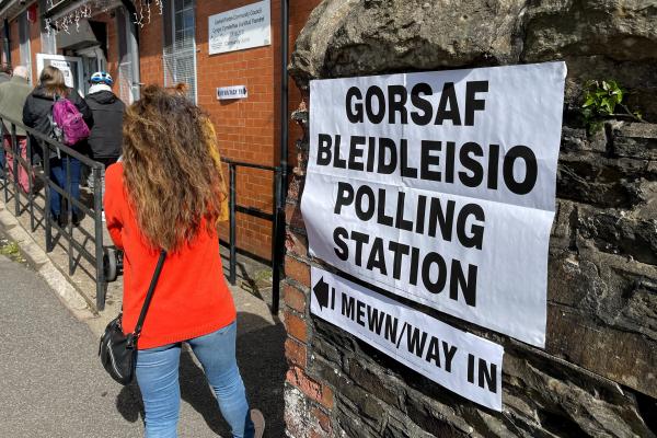 woman walking into polling station