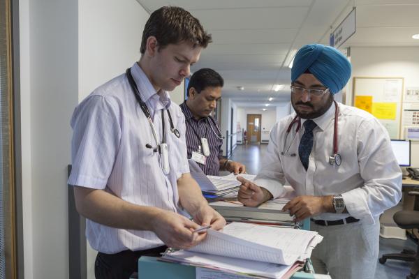 Doctors discussing medical chart