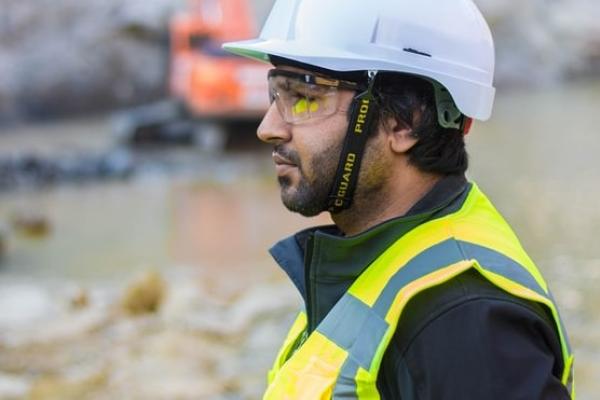 Man wearing safety suit on construction site