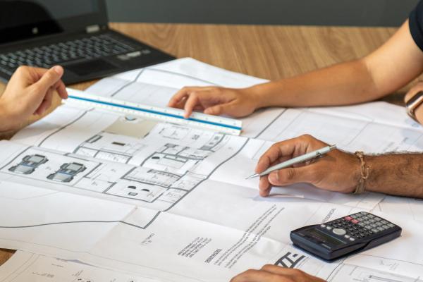 People working on construction/architecture plans