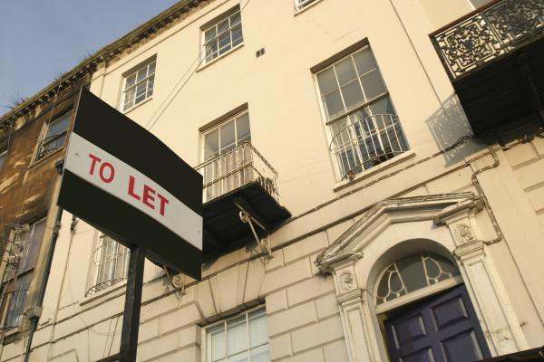 To let sign outside a 3 story house
